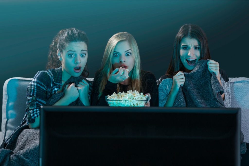 a group of young women watching a movie